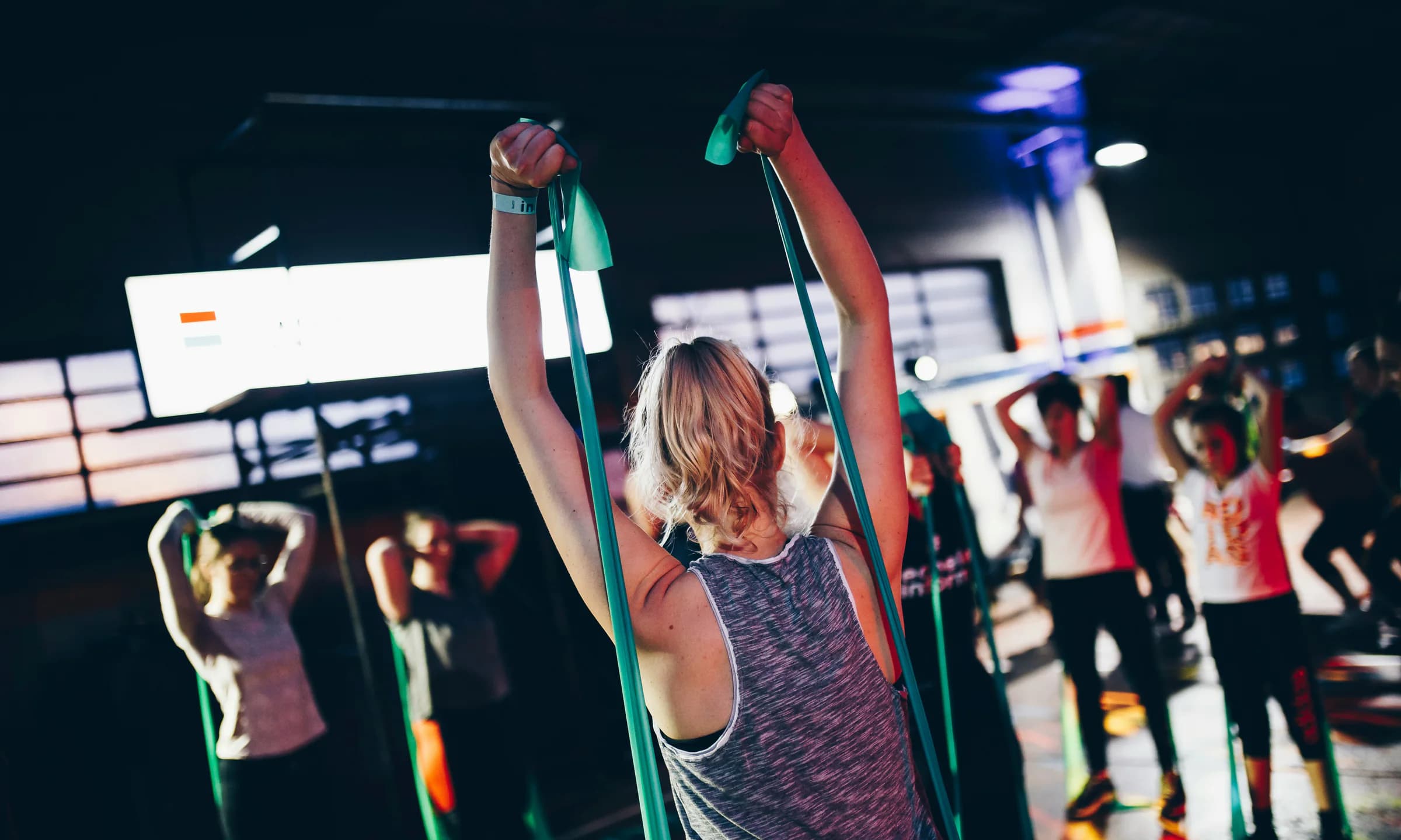 Members taking part in a coach-led group fitness class
