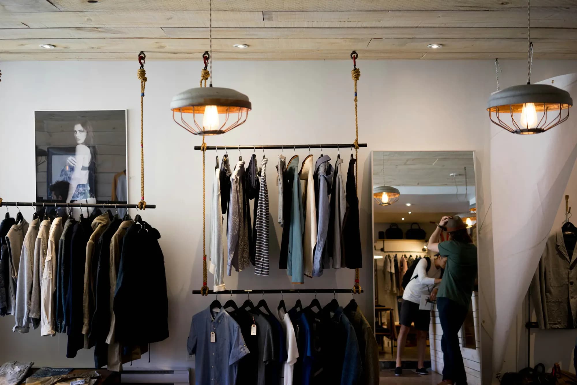 Clothes on rails in a small boutique