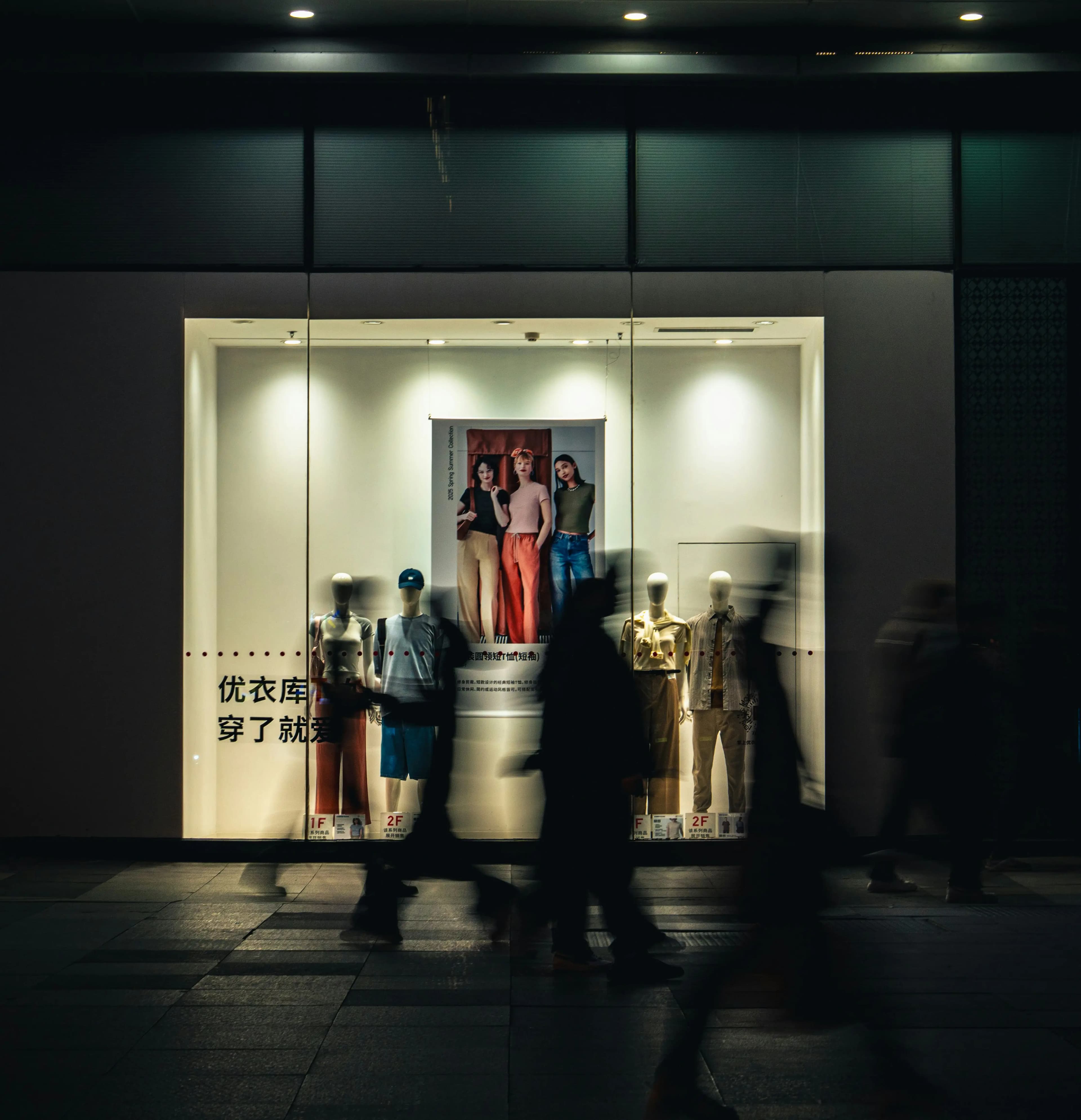 A shop owner serving a customer at the counter
