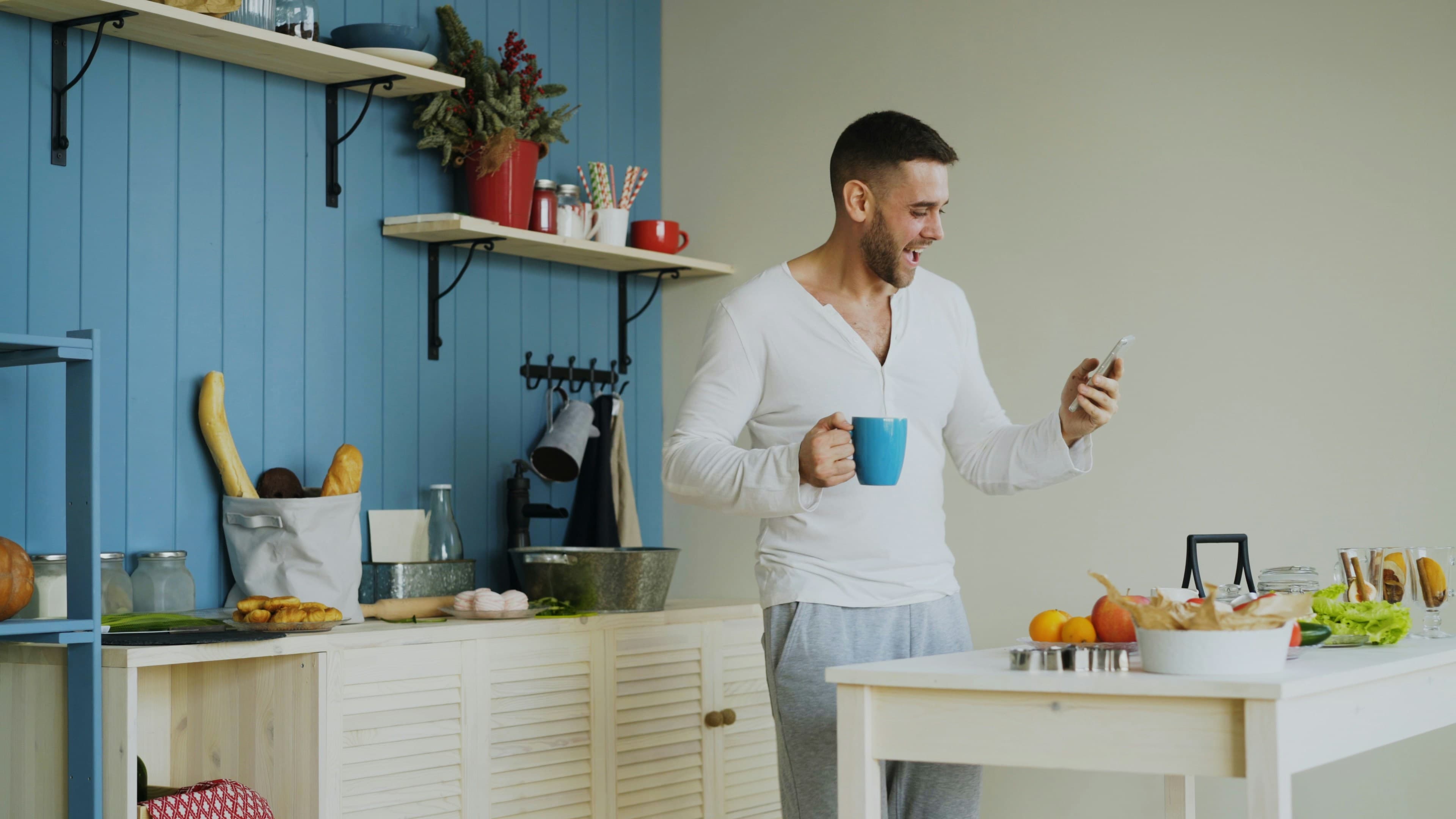 Someone checking their rewards on their phone at home